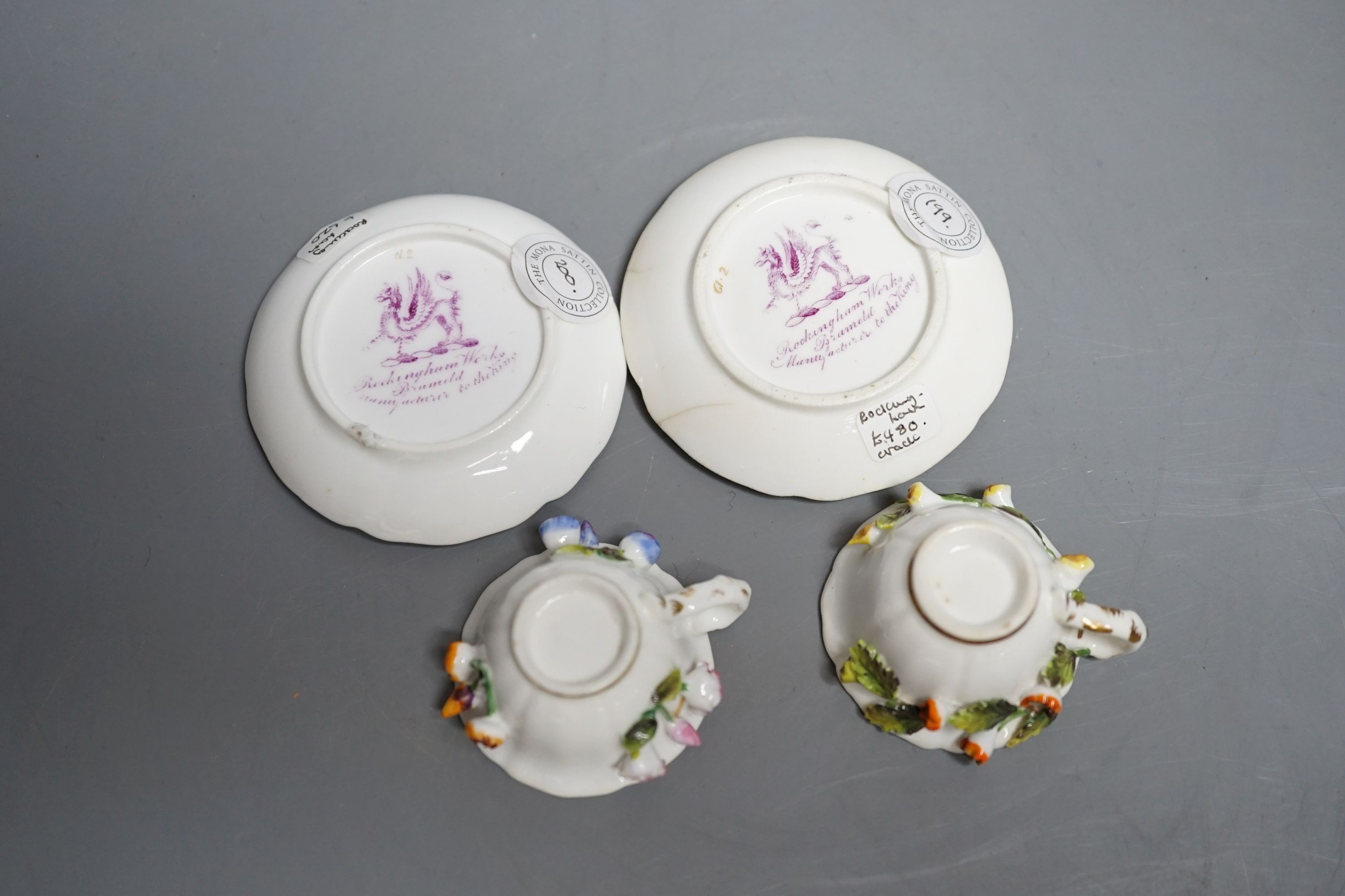 Two Rockingham miniature flower encrusted cups and saucers, c.1830. Provenance - Mona Sattin collection of miniature cups and saucers, collection no. 199 and 200.